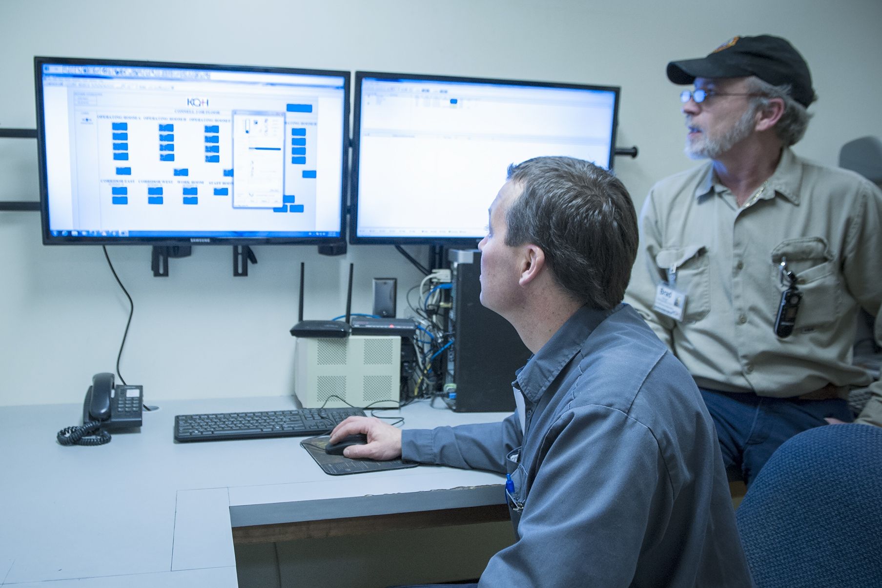 (From left) Peter Moeslinger, Master Electrician and Brad Wood, Refrigeration and Air Conditioning Mechanic keep an eye on the program that controls our air handling systems.