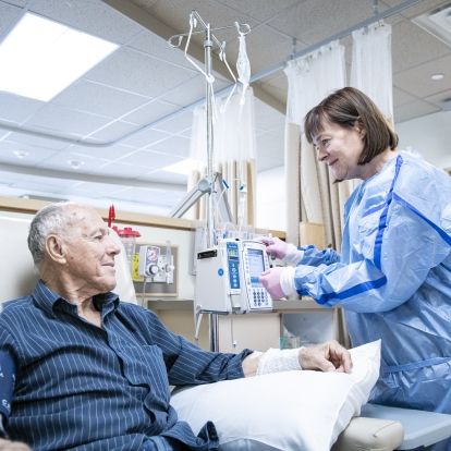A KHSC nurse speaking with a patient