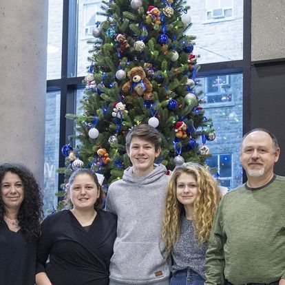 "We’re hoping that by just seeing the tree or maybe sitting nearby briefly, people will feel their worries ease, even for a few minutes, ” says Don McCullough (far right), posing here with his family (from left): Laura, Gabby, Luca and Lilly.