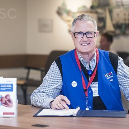 Volunteer Don Cooper greets patients from his post every Wednesday at the Cardiac Care Information Desk at KGH