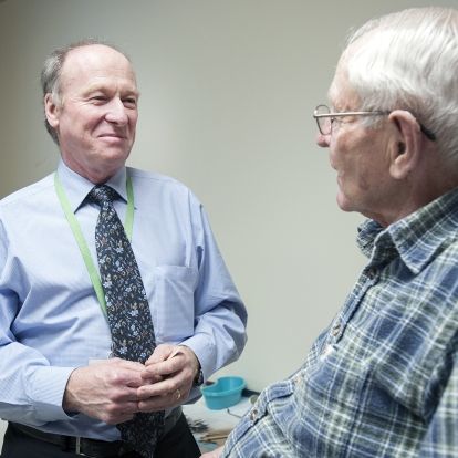 Doctor speaking with patient, follow up appointment, cancer care