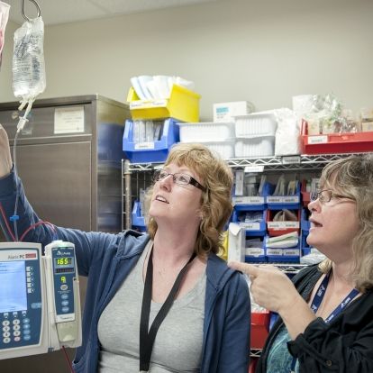 Transfusion Safety Officer Beverly Weaver (right) and Registered Nurse Suzanne Bashall discuss a blood transfusion being performed in our Post Anaesthetic Care Unit.
