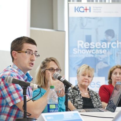 Researchs present their findings to a crowd at KGH.