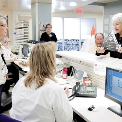 Patient Experience Advisors Anndale McTavish and Glenn Outhwaite will be part of this week's celebration. They are seen here taking our NRC Picker Innovative Best Practice Award 2012 on a tour of the hospital to share it with front-line staff.