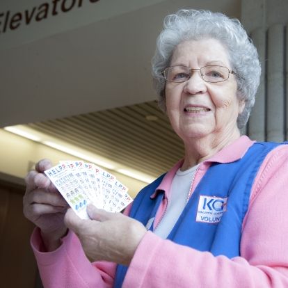 Auxiliary member Alice Roberston sells HELPP lottery tickets.