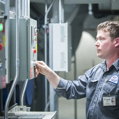 Plumber Frank Dereu operates an electronic control that improves efficiency.