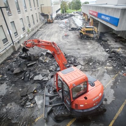 Construction crews remove the pavement from the KGH emergency ramp
