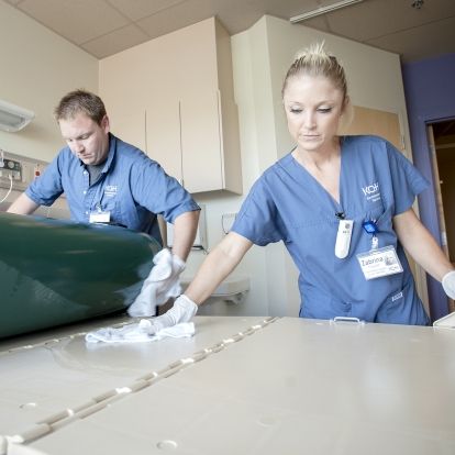 (From left) Environmental Assistants Ronnie Lott and Zabrina Ferguson work to ensure each patient room is cleaned to the highest standard.