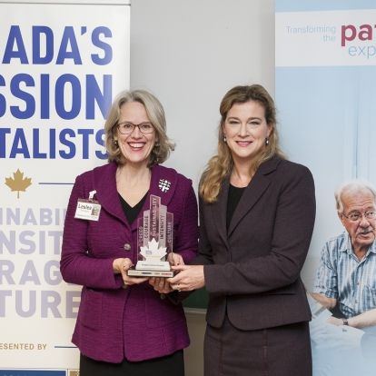 KGH President & CEO Leslee Thompson receives KGH's Passion Capital Award from Leslie Carter, Chief Brand & Strategy Officer at Knightsbridge Human Capital Solutions on December 1, 2014.