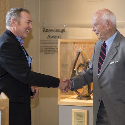 KGH Chief Operating Officer Jim Flett thanks Brit Smith for his donation towards a second MRI at KG