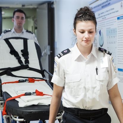 Community Patient Transfer Group Attendants Tyler Savage and Lindsay Raison prepare to pick up a patient in need of a non-urgent transfer from KGH.