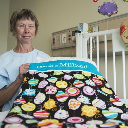 Liz Withers from Ryan's Case for Smiles celebrates the donation of the charity's one millionth pillowcase at KGH