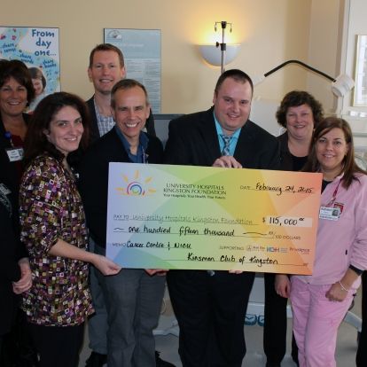 The big cheque: Kinsmen Dream Home Vice President Ryan Hanes presents a $115,000 donation from last year's lottery.