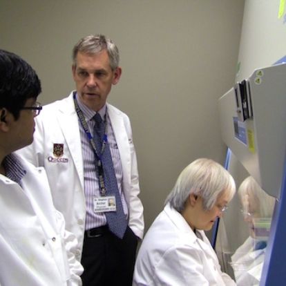 Dr. Archer with his colleagues in the lab