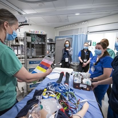 Members of a multidisciplinary team participate in simulation training in KHSC's Emergency Department, testing out the recently redesigned pediatric resuscitation carts