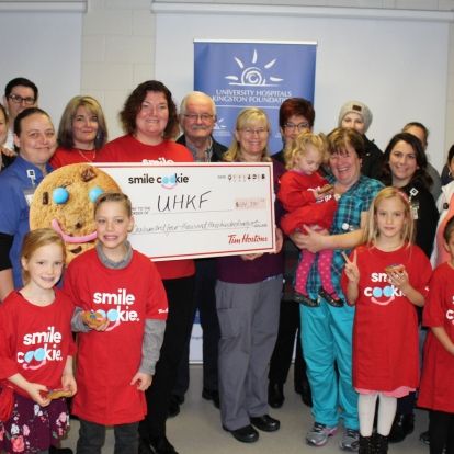 Representatives from local Tim Hortons present the proceeds of the campaign to KHSC and UHKF staff, patients and families
