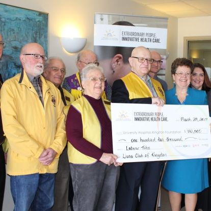 Members of the Lions Club present UHKF President & CEO Denise Cumming with their $110,000 donation to KHSC