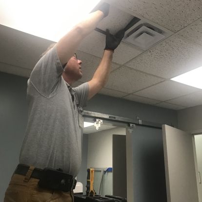 installing new ceiling tiles