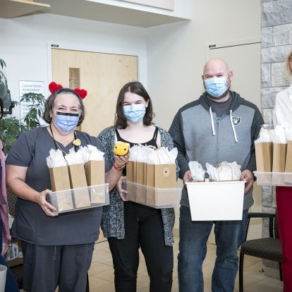 Tori with her donated bumble bees that she crocheted