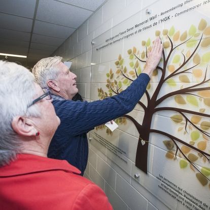 Family members were invited to place the names of their loved ones on the new memorial wall.