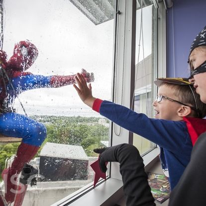 Superheroes from Elite Window Cleaning bring smiles to our youngest patients at our KGH site.