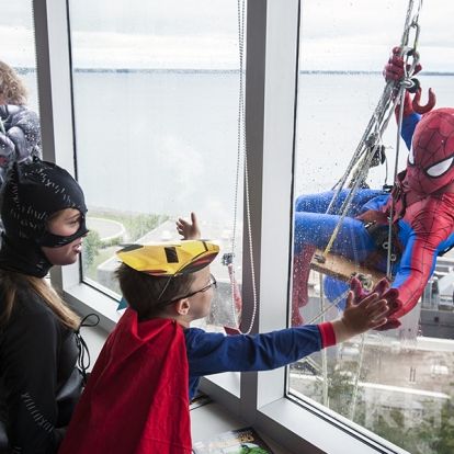 Superheroes from Elite Window Cleaning bring smiles to our youngest patients at our KGH site.