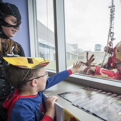 Superheroes from Elite Window Cleaning bring smiles to our youngest patients at our KGH site.