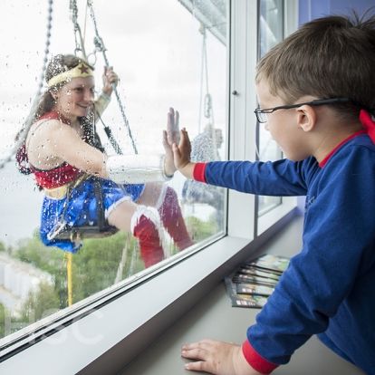 Superheroes from Elite Window Cleaning bring smiles to our youngest patients at our KGH site.