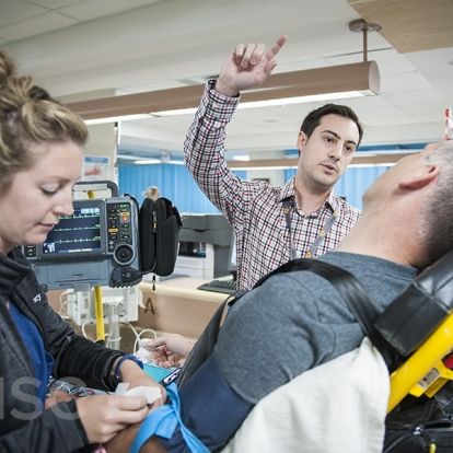 KHSC staff and physicians with with a mock patient in the Emergency Department during an EVT simulation case