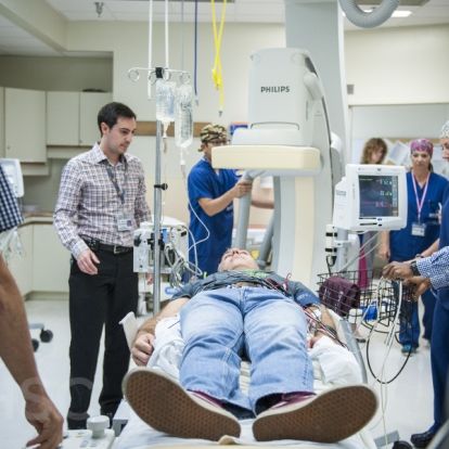KHSC staff and physicians in an Interventional Radiology suite during an EVT simulation case