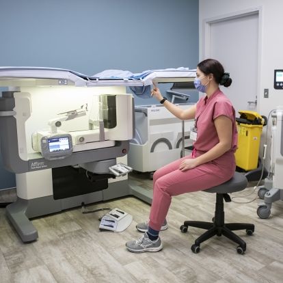 Amanda MacInnis demonstrates the new prone breast biopsy table that helps provide better accuracy, shorter procedures and improved patient comfort for those receiving a breast mammography and biopsy.