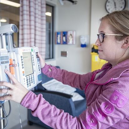 3096 - Jessica Amey, a Charge Nurse with the Pediatrics team prepares an infusion with one of the new syringe pumps.