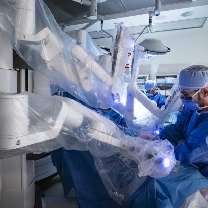 Dr. Patel prepares the robot for surgery in an OR at our KGH site.
