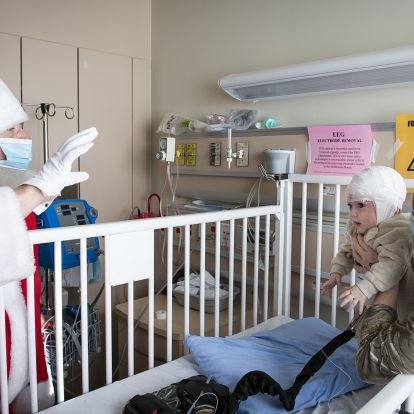 Santa distributes toys donated by the Royal Canadian Air Force to pediatric patients at KHSC