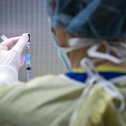 COVID-19 vaccination is drawn into a syringe