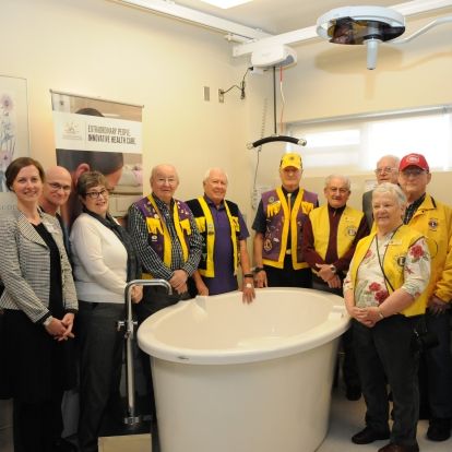 Members of the Lions Club and KHSC's labour and delivery team unveil the new tubs