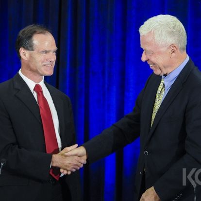 Hotel Dieu Board Chair Michael Hickey (L) and KGH Board Chair George Thomson (R) shake hands at the end on the announcement press conference.