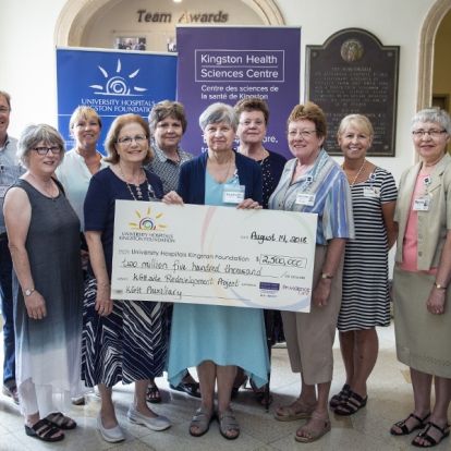 Members of the KGH Auxiliary present a cheque to representatives of the University Hospital's Kingston Foundation as well as the KHSC Board of Directors and Executive team.