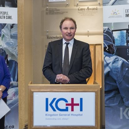 KCCU CEO Jon Desseau announces a $60,000 donation for the KGH lab