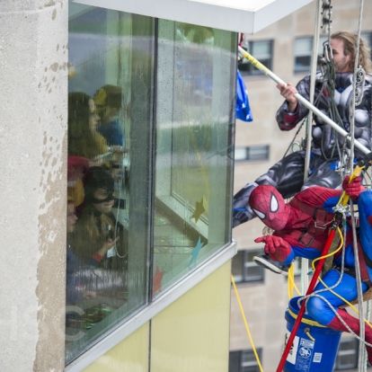 Superheroes from Elite Window Cleaning bring smiles to our youngest patients at our KGH site.
