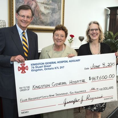 Auxiliary President Jenny Raymond (centre) hands a cheque worth just under $470,000 to KGH Board Chair Scott Carson and CEO Leslee Thompson.