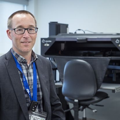 Dr. Gord Boyd with the KINARM in the W.J. Henderson Centre for Patient Oriented Research.