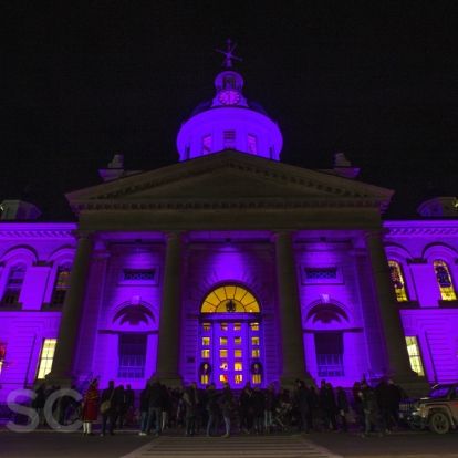Kingston City Hall is illuminated by purple lights to recognize World Prematurity Day