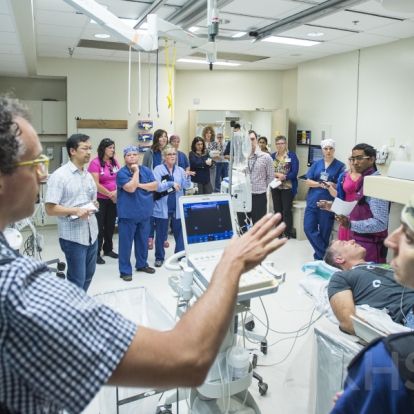 KHSC staff and physicians in an Interventional Radiology suite during an EVT simulation case