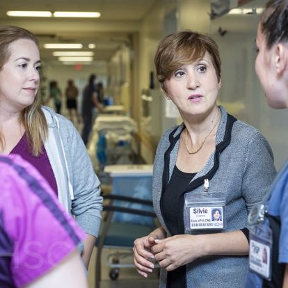 Registered nurses Erin Lowry and Morag Mercer, and nursing student Paige Blanchard on Kidd 6 gather with Silvie Crawford, Executive Vice-president and Chief Nursing Executive of Patient Care Programs at KHSC to discuss what it means to be designated a Best Practice Spotlight Organization. Kidd 6 will be the first team to implement best practice guidelines related to the designation –- starting in Oct. with guidelines for preventing falls and dealing with pressure injuries.