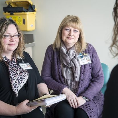 Clinic staff meet with patients to discuss their sexual health