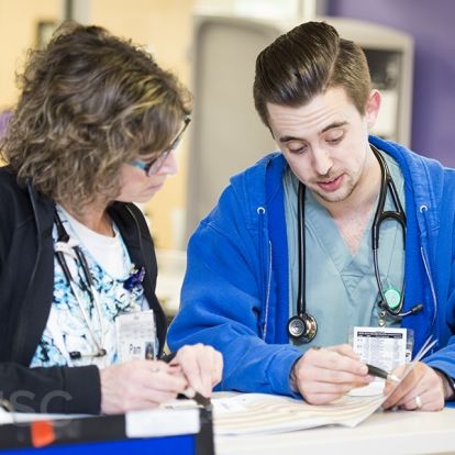 Staff in our inpatient pediatric unit review a patient's PEWS score