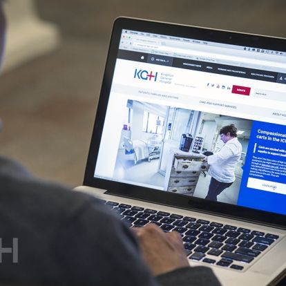 A view of the new corporate website on a laptop computer.