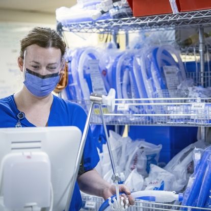 Respiratory Therapist Sarah Stanley prepares equipment for use in the ICU.