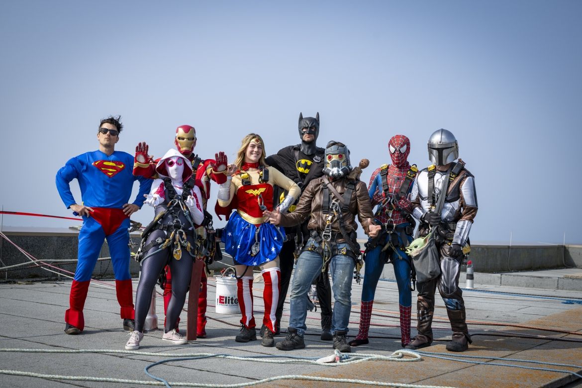 superhero window washers on the roof of KGH